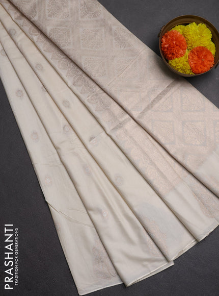 Semi chanderi saree cream with allover zari woven buttas and zari woven butta border