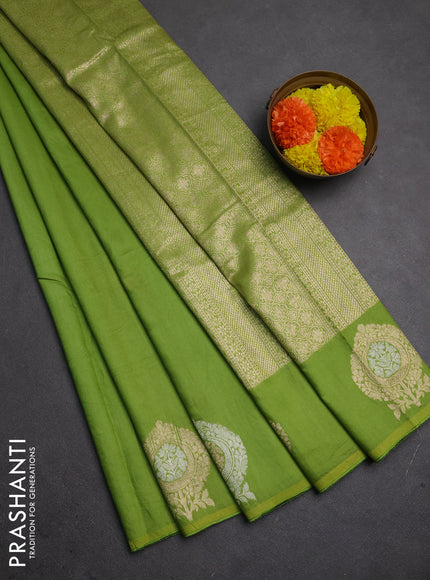 Semi chanderi saree light green with plain body and zari woven butta border