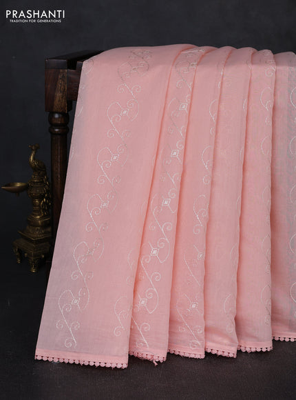 Mul chanderi saree peach shade with allover embroidery work and floral embroidery pallu