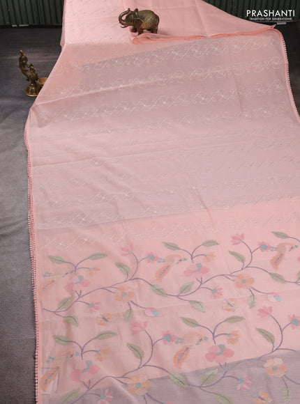 Mul chanderi saree peach shade with allover embroidery work and floral embroidery pallu