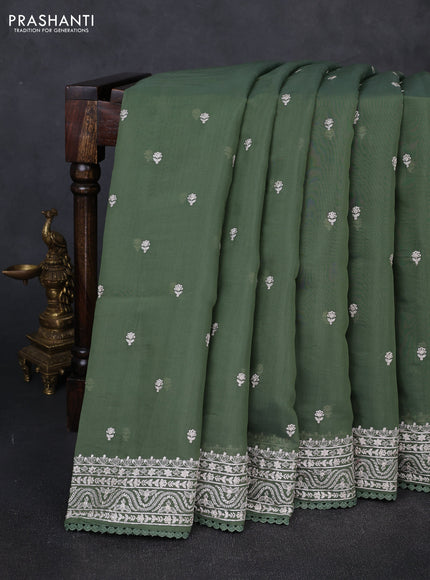 Mul chanderi saree sage green with embroidery buttas and embroidery border