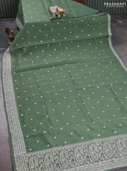 Mul chanderi saree sage green with embroidery buttas and embroidery border