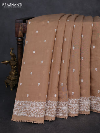 Mul chanderi saree dark beige with embroidery buttas and embroidery border
