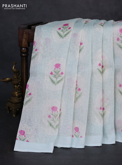 Pure linen silk saree mild teal blue with allover floral digital prints and simple border