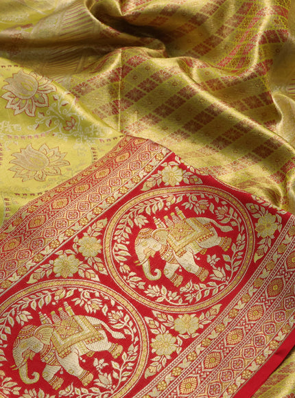 Pure kanchipuram tissue silk saree lime green and red with allover zari woven brocade weaves and long elephant zari woven border
