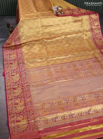 Pure kanchipuram tissue silk saree mustard yellow and pink with allover zari woven brocade weaves and long elephant zari woven border