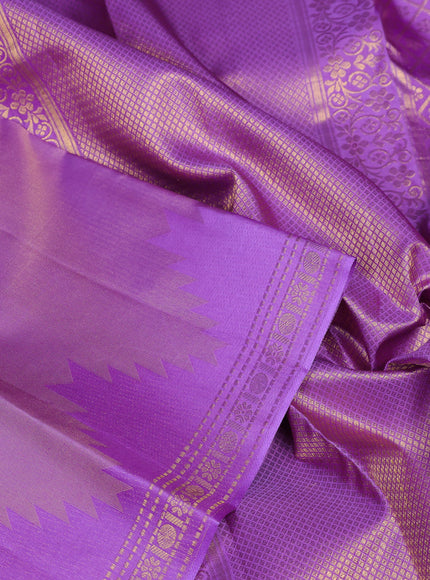 Pure kanchipuram silk saree lavender with plain body and temple design zari woven border