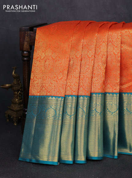 Pure kanchipuram silk saree orange and teal green with allover zari woven brocade weaves and long rich zari woven korvai border
