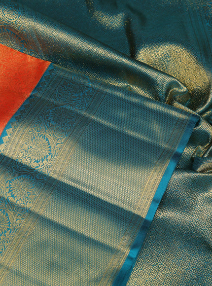 Pure kanchipuram silk saree orange and teal green with allover zari woven brocade weaves and long rich zari woven korvai border