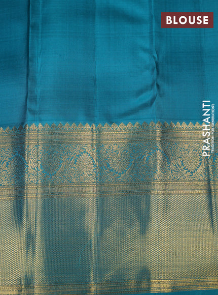 Pure kanchipuram silk saree orange and teal green with allover zari woven brocade weaves and long rich zari woven korvai border