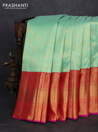 Pure kanchipuram silk saree teal green and red with allover zari woven brocade weaves and long rich zari woven korvai border