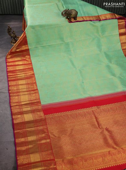 Pure kanchipuram silk saree teal green and red with allover zari woven brocade weaves and long rich zari woven korvai border