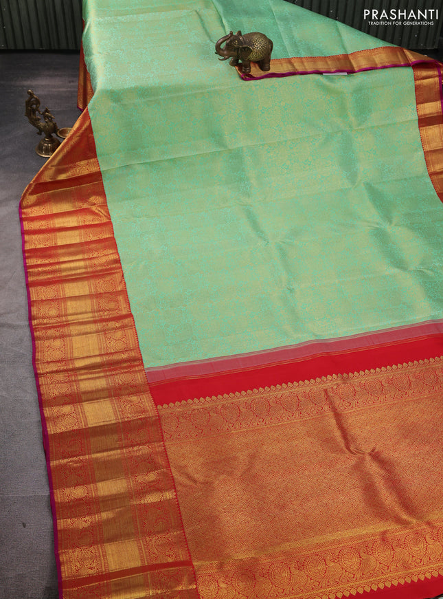 Pure kanchipuram silk saree teal green and red with allover zari woven brocade weaves and long rich zari woven korvai border
