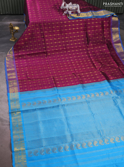 Silk cotton saree purple and cs blue with allover zari checks & buttas and zari woven border