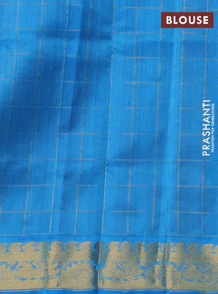 Silk cotton saree purple and cs blue with allover zari checks & buttas and zari woven border