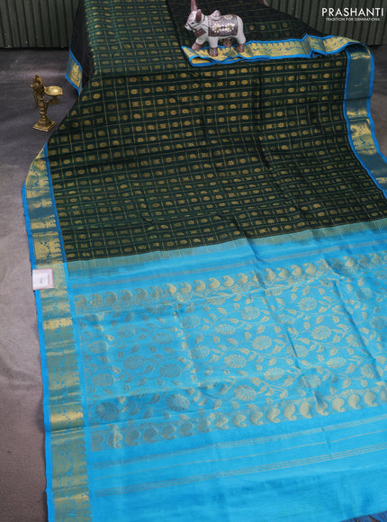 Silk cotton saree bottle green and cs blue with allover zari checks & buttas and zari woven border
