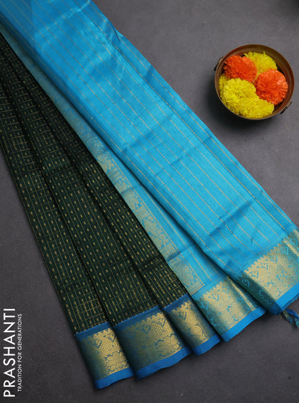 Silk cotton saree bottle green and cs blue with allover lakshadeepam pattern and zari woven border