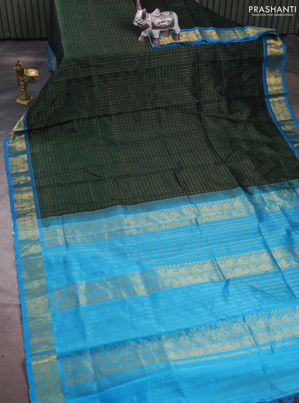 Silk cotton saree bottle green and cs blue with allover lakshadeepam pattern and zari woven border