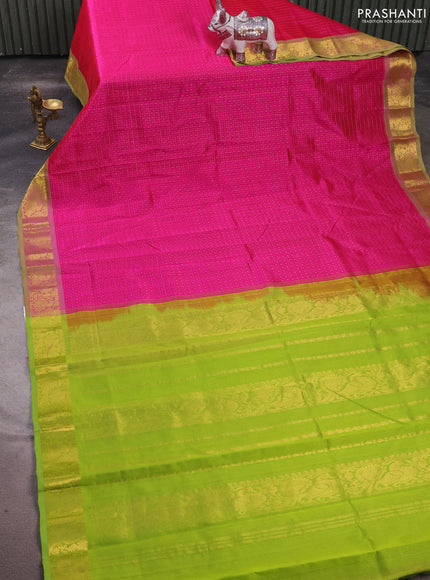Silk cotton saree pink and light green with allover lakshadeepam pattern and zari woven border