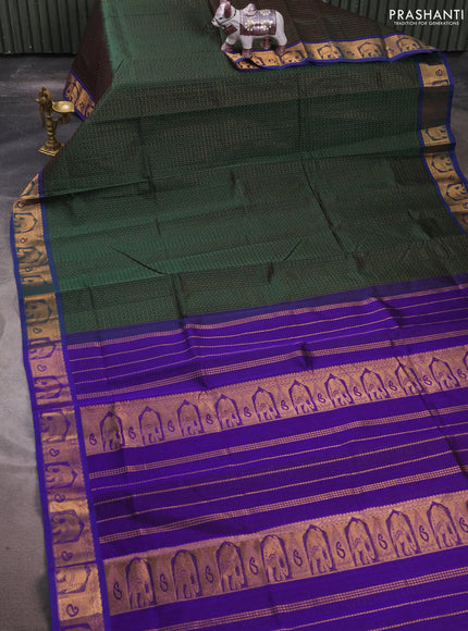 Silk cotton saree bottle green and violet with allover lakshadeepam pattern and zari woven border
