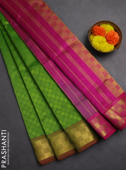 Silk cotton saree light green and dark magenta pink with allover self emboss jacquard and zari woven border