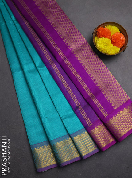 Silk cotton saree teal blue and purple with allover self emboss jacquard and zari woven border