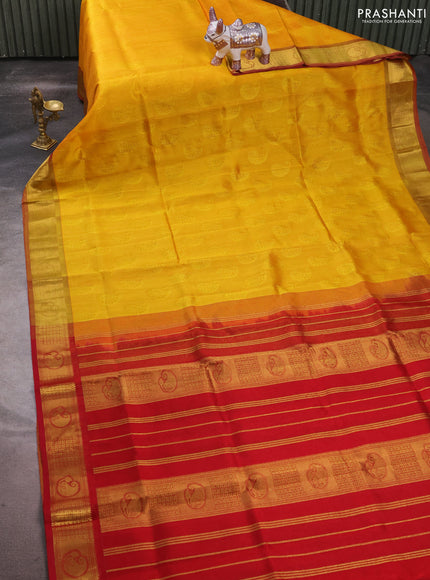 Silk cotton saree mango yellow and maroon with allover self emboss jacquard and zari woven border