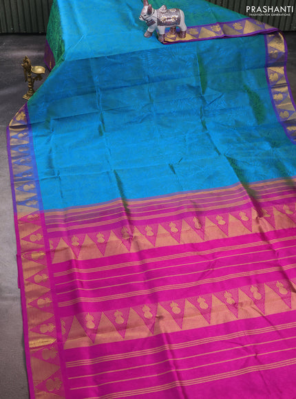 Silk cotton saree dual shade of teal bluish green and purple with allover self emboss jacquard and zari woven border