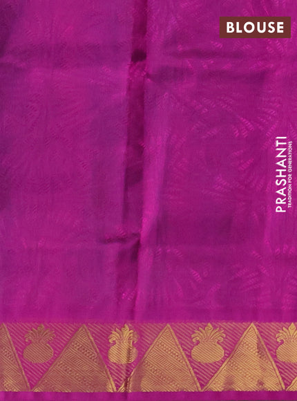 Silk cotton saree dual shade of teal bluish green and purple with allover self emboss jacquard and zari woven border