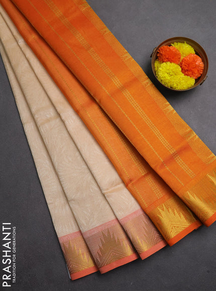 Silk cotton saree cream and orange with allover self emboss jacquard and zari woven border
