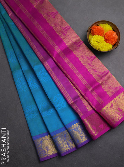 Silk cotton saree dual shade of teal bluish green and purple with allover self emboss jacquard and elephant zari woven border
