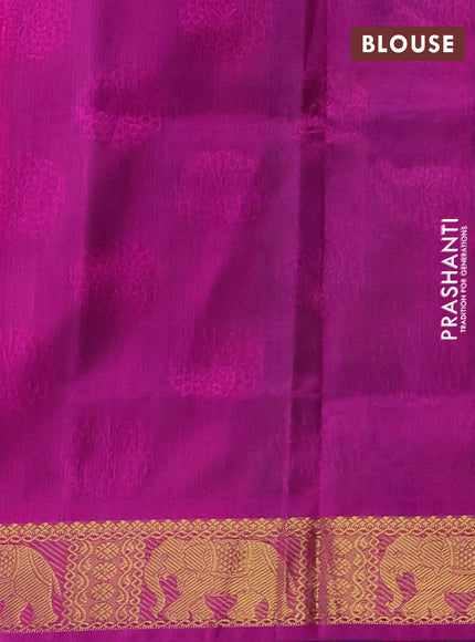 Silk cotton saree dual shade of teal bluish green and purple with allover self emboss jacquard and elephant zari woven border