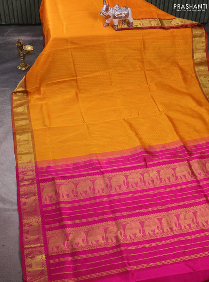 Silk cotton saree mango yellow and magenta pink with allover self emboss jacquard and elephant zari woven border