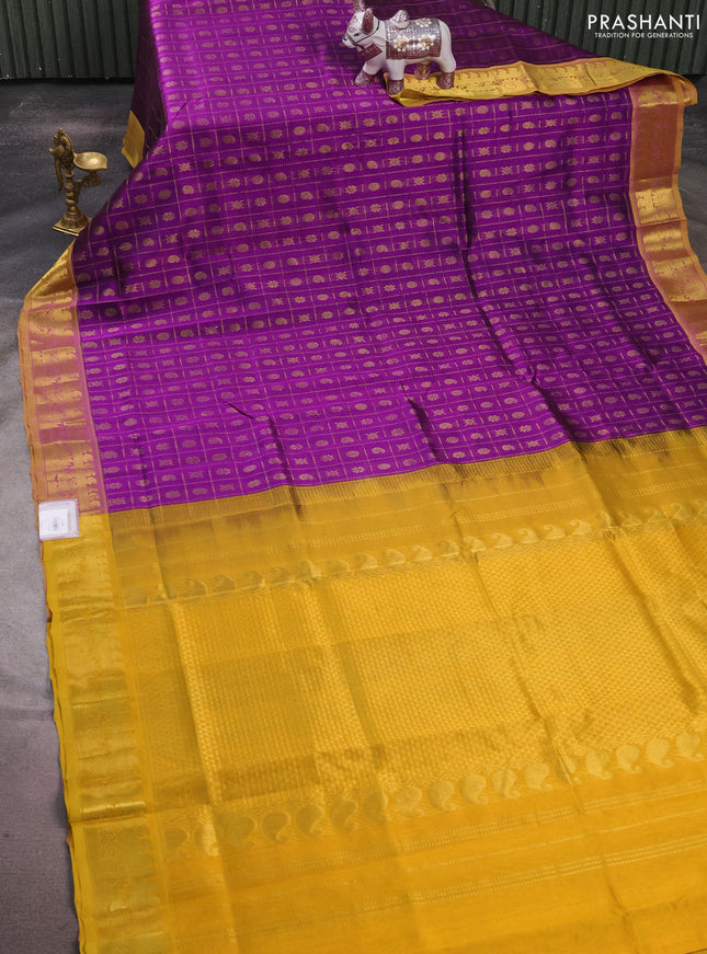 Silk cotton saree purple and mustard yellow with allover zari checks & buttas and zari woven border