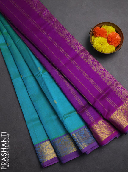 Silk cotton saree dual shade of teal bluish green and purple with zari woven buttas and zari woven border