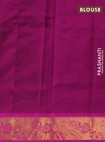 Silk cotton saree dual shade of bottle green and purple with zari woven buttas and peacock zari woven border