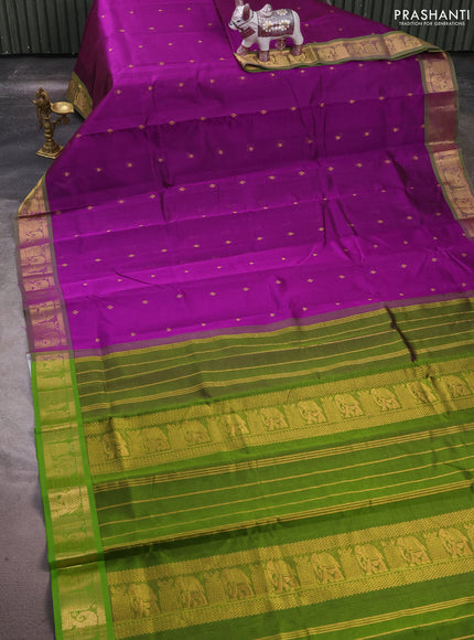 Silk cotton saree purple and mehendi green with allover zari woven buttas and elephant zari woven border