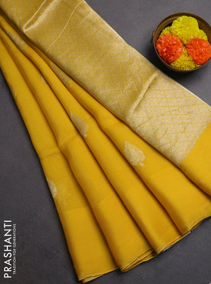 Silk kota saree yellow with allover silver zari woven buttas and simple border