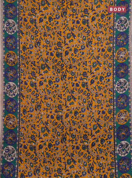 Kalamkari cotton saree mustard yellow and green with allover prints and printed border