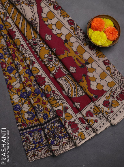 Kalamkari cotton saree mustard yellow and blue with allover prints and printed border