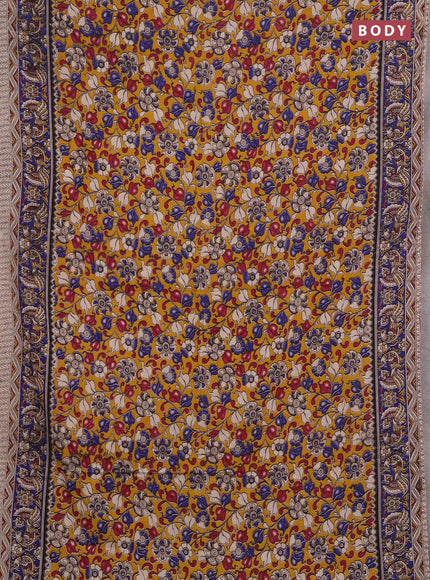 Kalamkari cotton saree mustard yellow and blue with allover prints and printed border