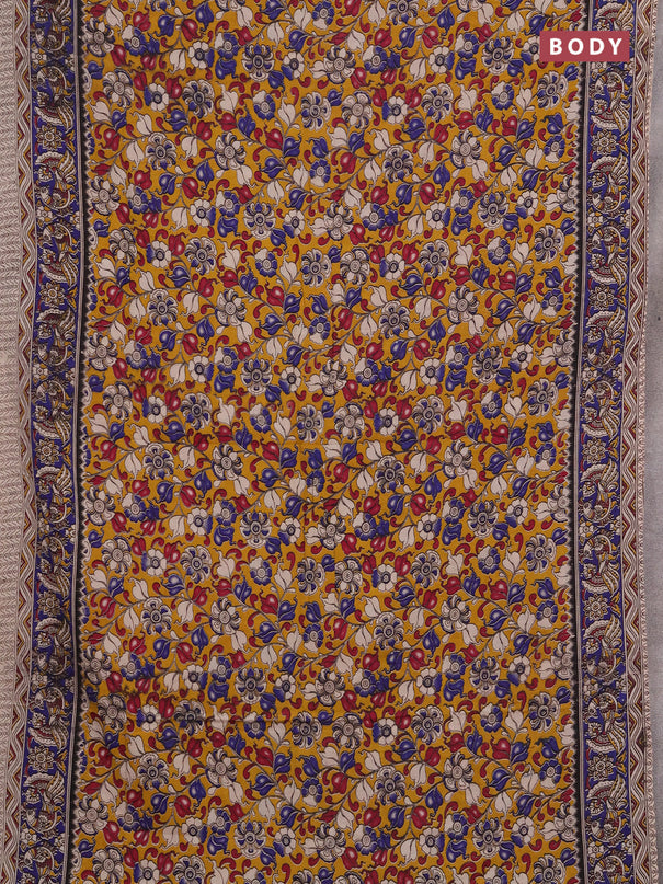 Kalamkari cotton saree mustard yellow and blue with allover prints and printed border