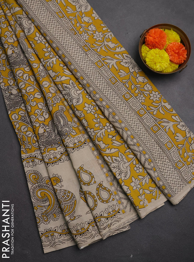 Kalamkari cotton saree mustard yellow and beige with allover prints and long printed border