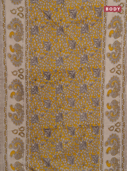 Kalamkari cotton saree mustard yellow and beige with allover prints and long printed border