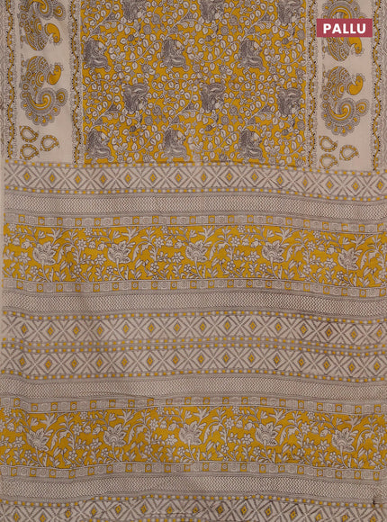 Kalamkari cotton saree mustard yellow and beige with allover prints and long printed border