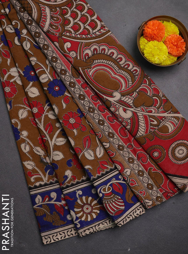 Kalamkari cotton saree dark mustard and blue with allover prints and printed border