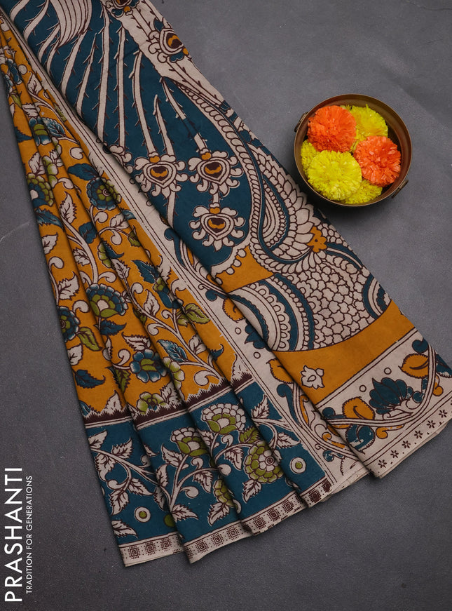 Kalamkari cotton saree mustard yellow and peacock green with allover prints and printed border