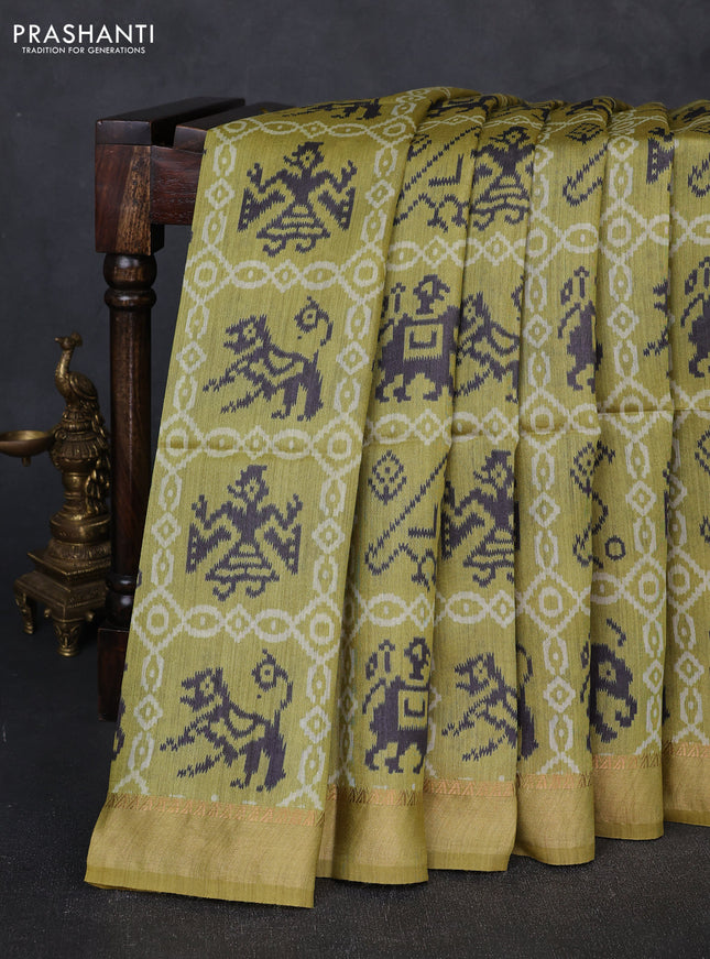 Munga tussar silk saree mustard green with allover patola prints and zari woven border