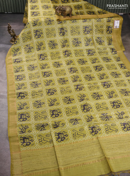 Munga tussar silk saree mustard green with allover patola prints and zari woven border