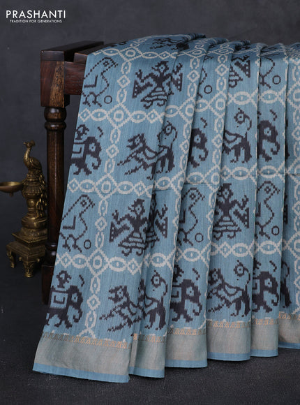 Munga tussar silk saree pastel blue with allover patola prints and zari woven border